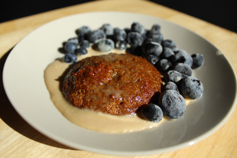 cookies with milk and blueberries on a white plate