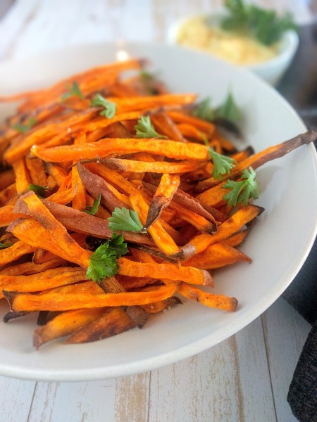 Sweet potato fries with spicy mayo in background