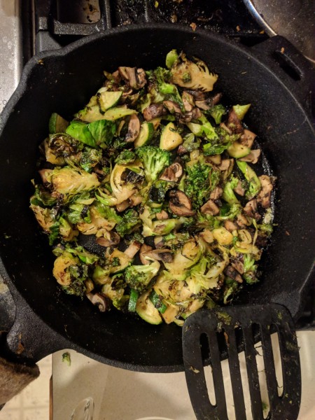 Vegetables being cooked in the cast iron