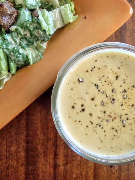 Homemade Caesar dressing, made in a food processor. 