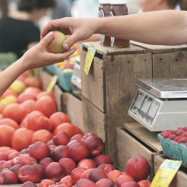 Buying fruit at farmer's market