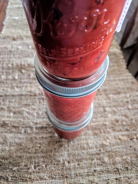 Stacked jars of homemade sugar free ketchup.