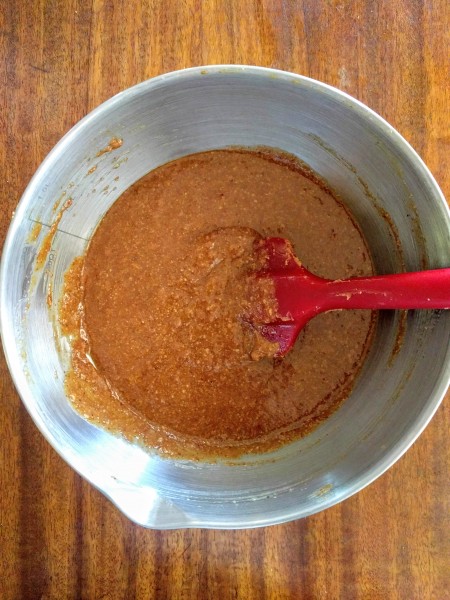 Wet ingredients mixed in a bowl with rubber spatula.