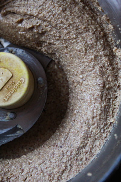 close up image of almond butter in food processor