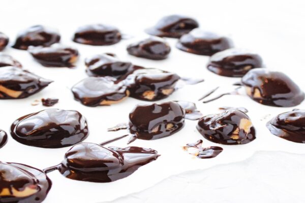 Chocolate covered peanut butter balls on a tray