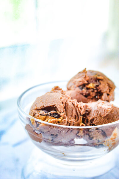 Scoops of chocolate peanut butter ice cream in a bowl