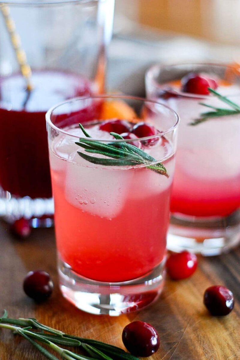 Cranberry, Orange And Rosemary Shrub Mocktail  with ice in a glass