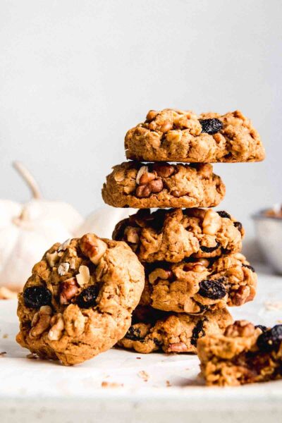 stacked gluten free oatmeal pumpkin cookies with raisins and walnuts