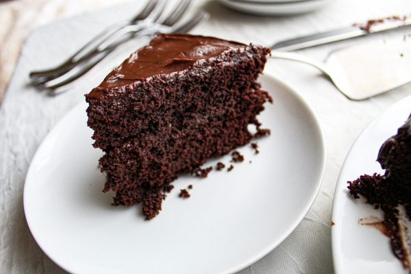 slice of Paleo chocolate cake on white plate