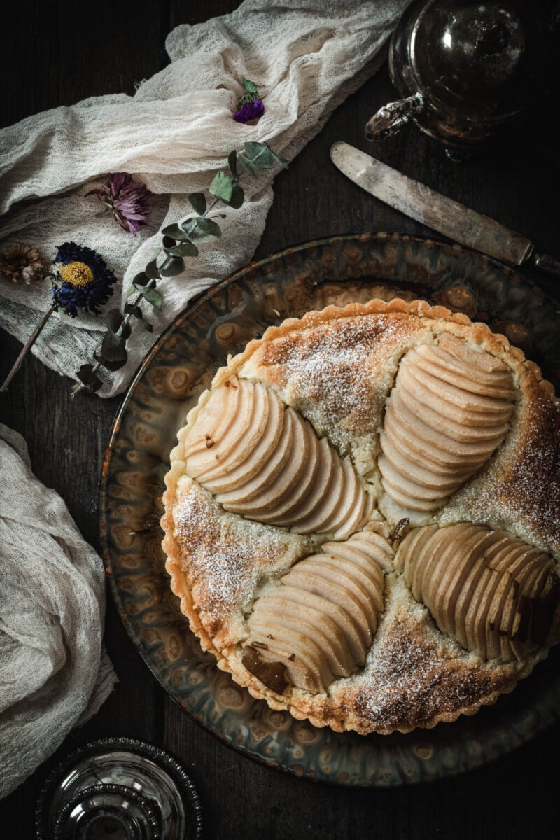 baked tart topped with baked sliced pears 