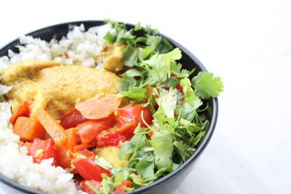 slow cooker chicken curry in black bowl