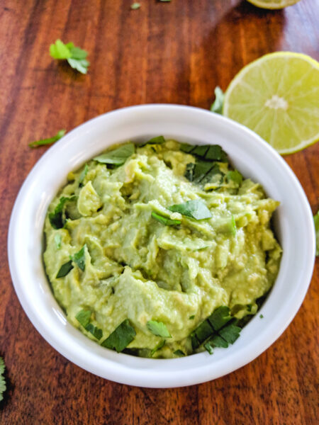 4 ingredient guacamole in white ramekin