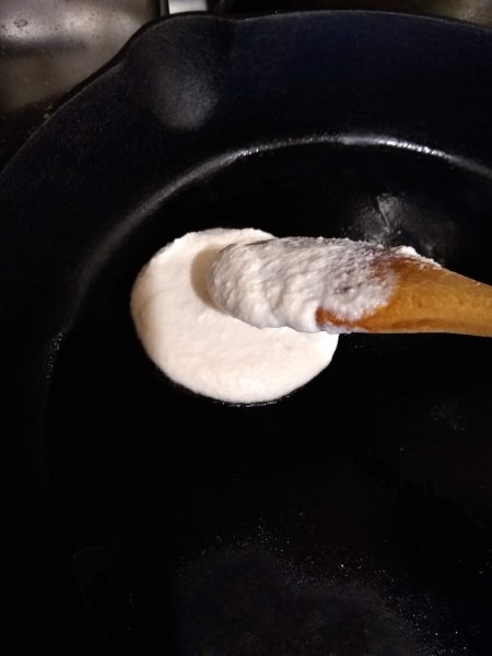 Scoop batter into pan and spread out with spoon
