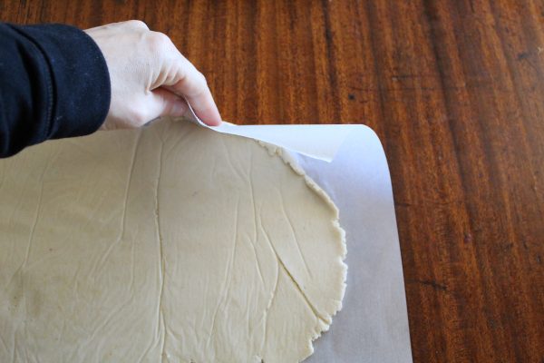 coconut flour pizza dough rolled up at edges