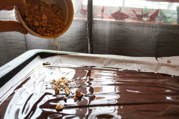 Crushed almonds poured over melted chocolate