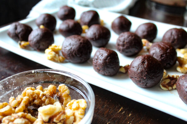 Rolled brownie balls on platter