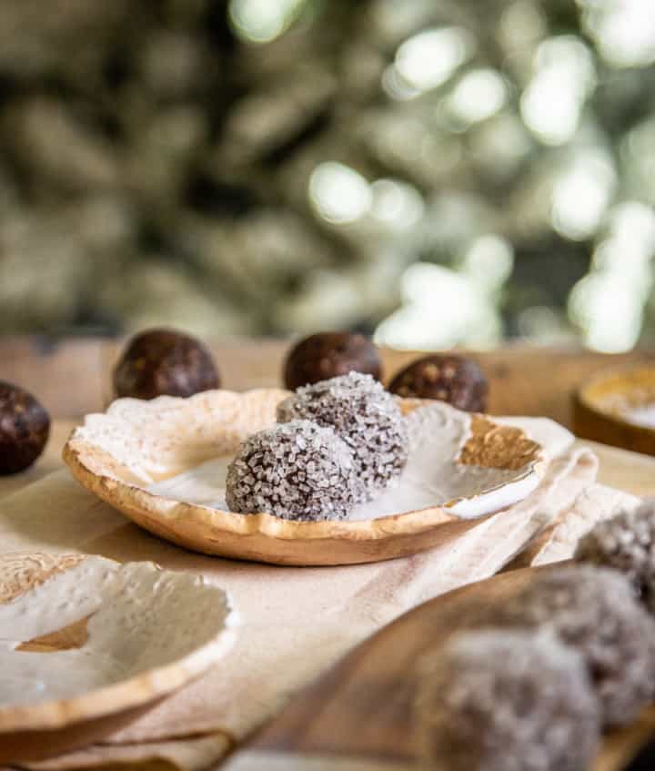 sugar plums coated with crystal white sugars on a golden platelet
