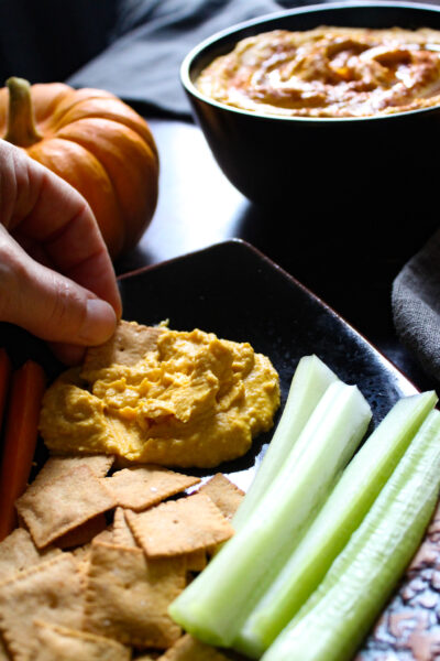 pumpkin hummus with veggies on appetizer plate