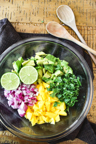 Overhead view of mango avocado salad ingredients before being mixed