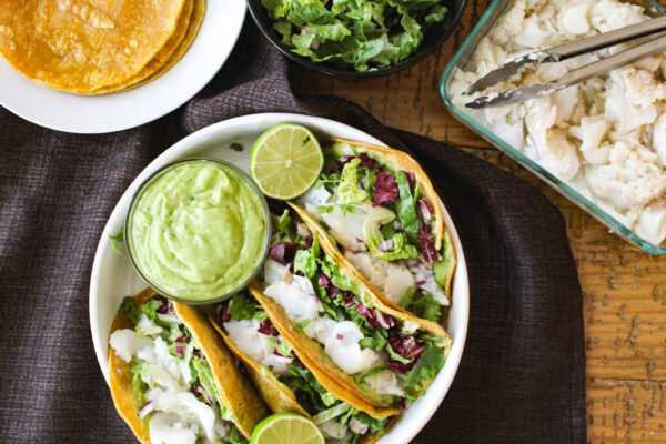 Fish tacos with creamy avocado lime sauce