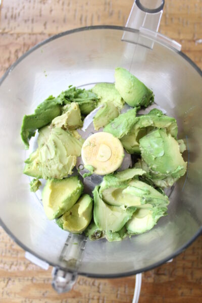 step 1 - avocados in bowl of food processor