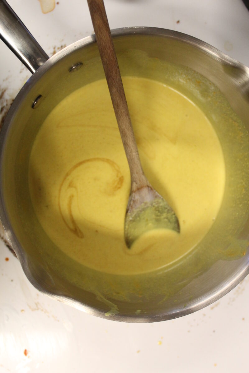 step 2 - add coconut milk, turmeric powder and heat