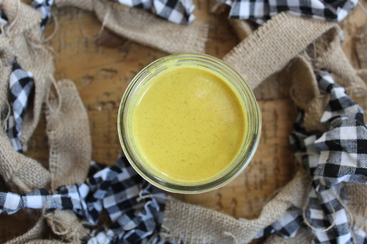 Overhead view of coconut curry sauce in jar