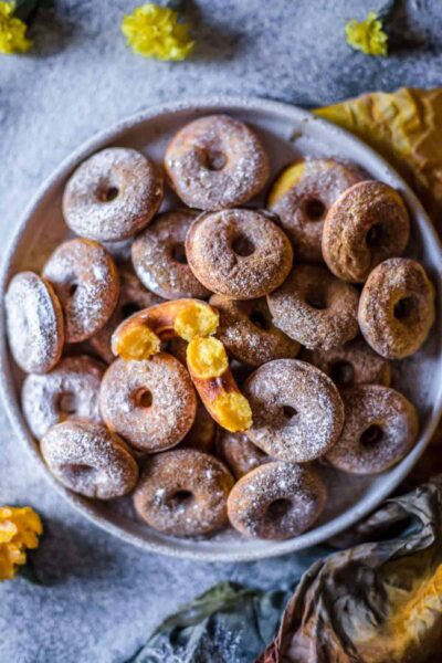 mini pumpkin donuts on a plate