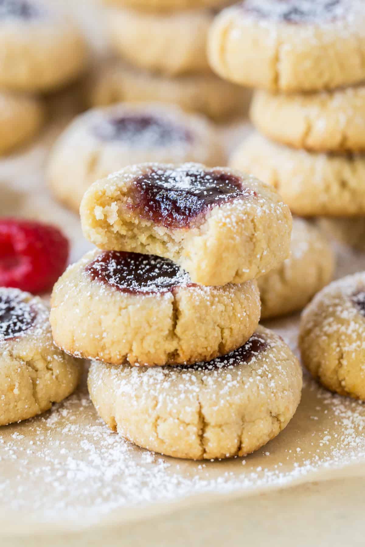 raspberry almond thumbprint cookies with powdered sugar