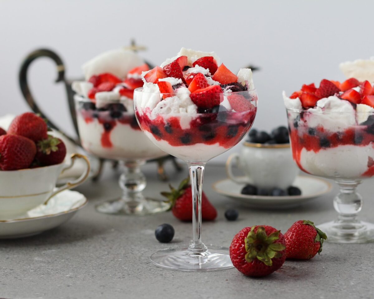 colorful mouse with strawberries and blueberries in wine glasses