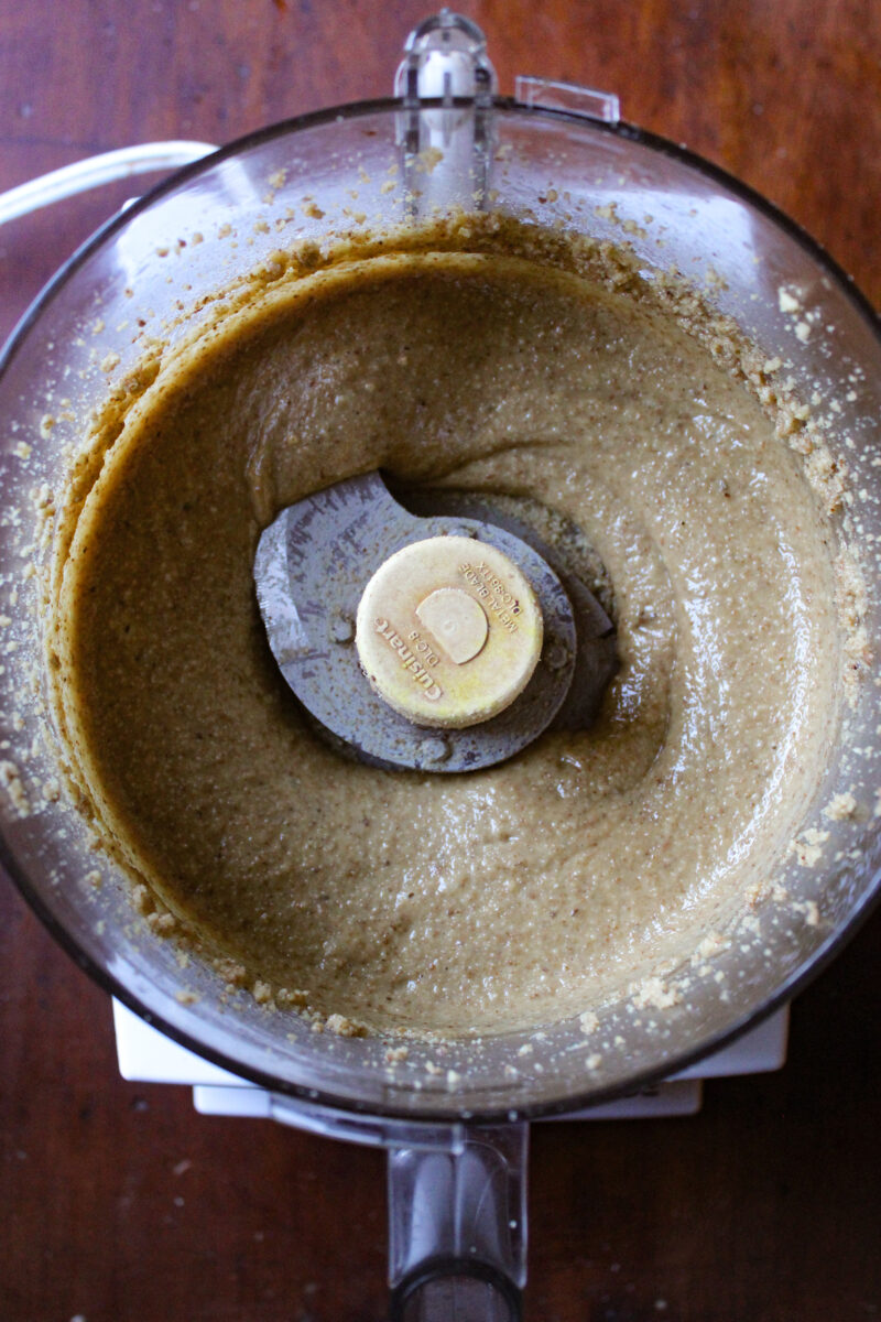 Blended walnut butter in food processor.