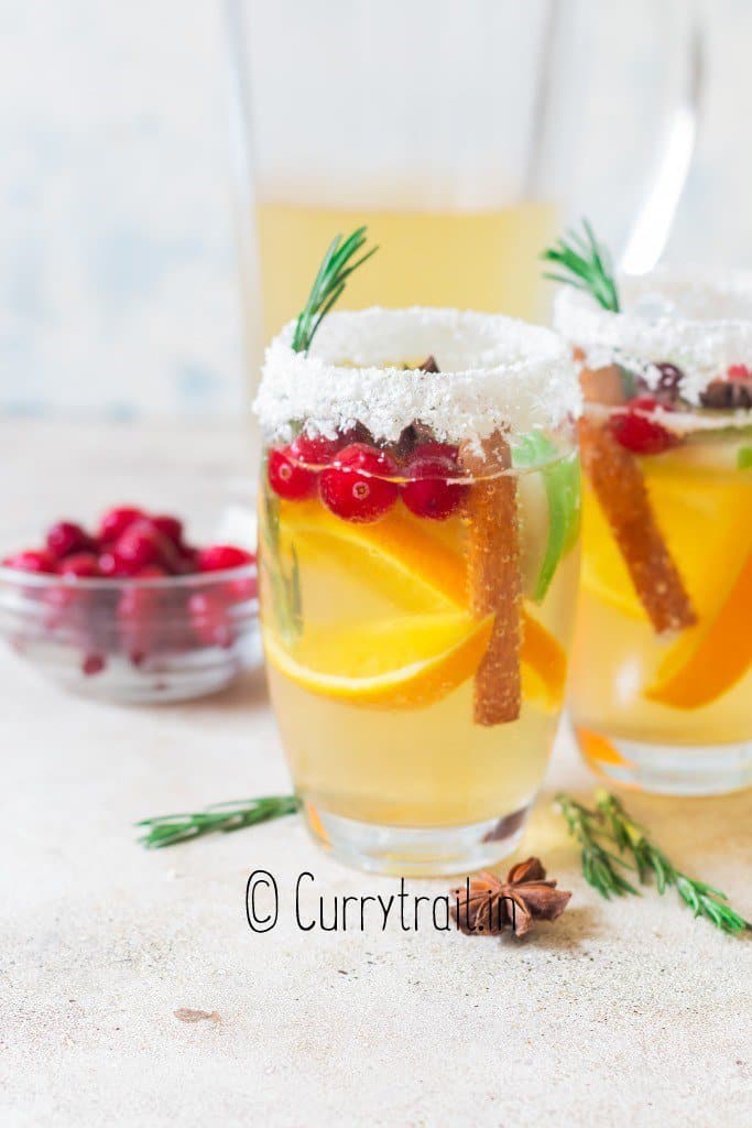 festive white wine Christmas sangria rimmed with snowy white coconut flakes