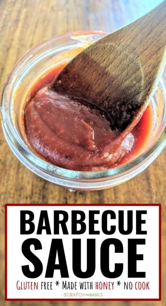 Barbecue sauce in jar with wooden spoon.