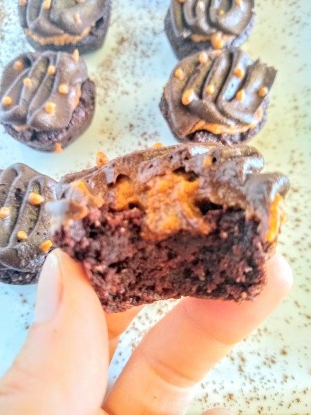 Pumpkin filled brownie bites with chocolate frosting.