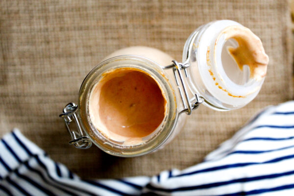 close up image of homemade chipotle sauce in a wide mouth mason jar