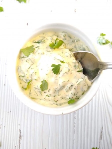 Bowl of cilantro lime mayo with spoon
