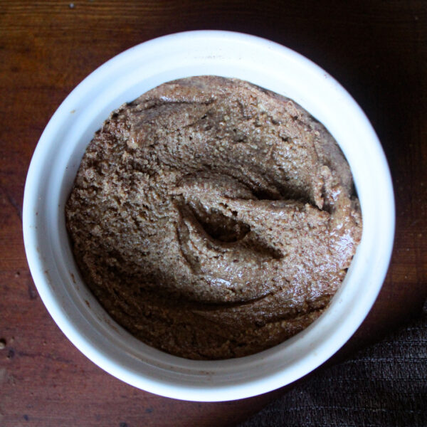 close up image of finished cinnamon almond butter in a white bowl