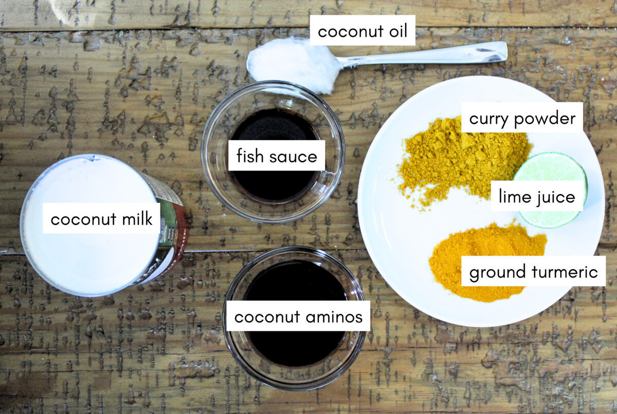 coconut curry sauce ingredients on wooden table