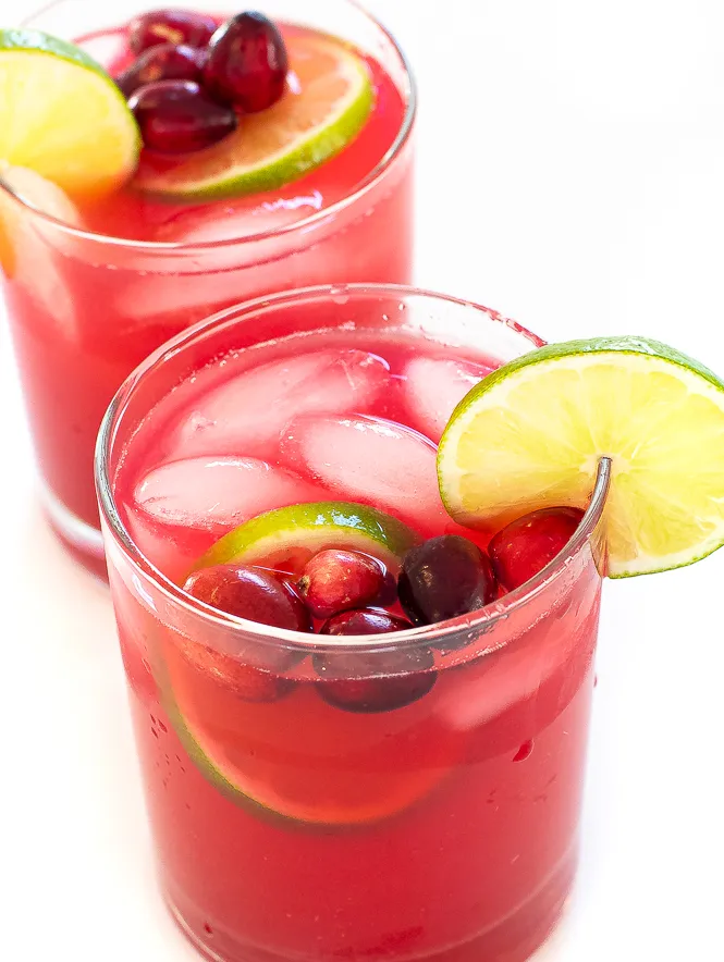 cranberry margaritas with ice, lime and cranberries