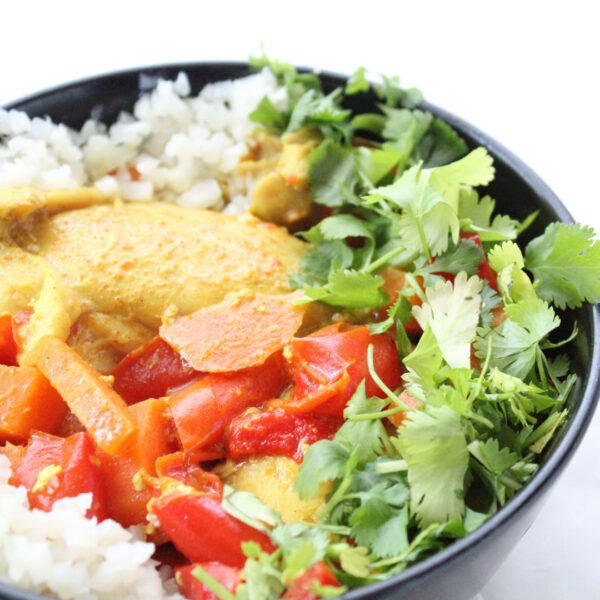 close up chicken curry from crockpot on rice