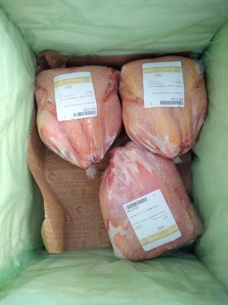 Three whole pastured chickens inside the Crowd Cow box - farm fresh meat.