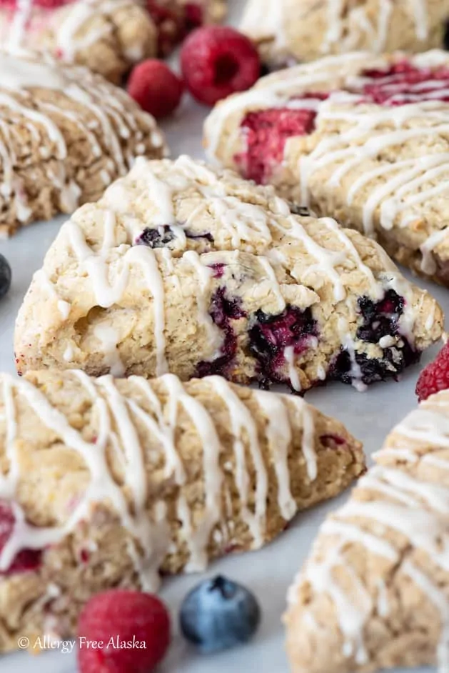 gluten-free blueberry scones drizzled with powdered sugar glaze