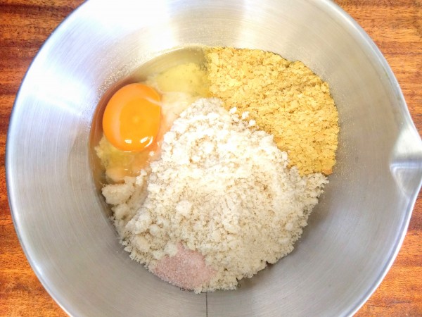 mixture of egg, almond flour, nutritional yeast and salt on a mixer