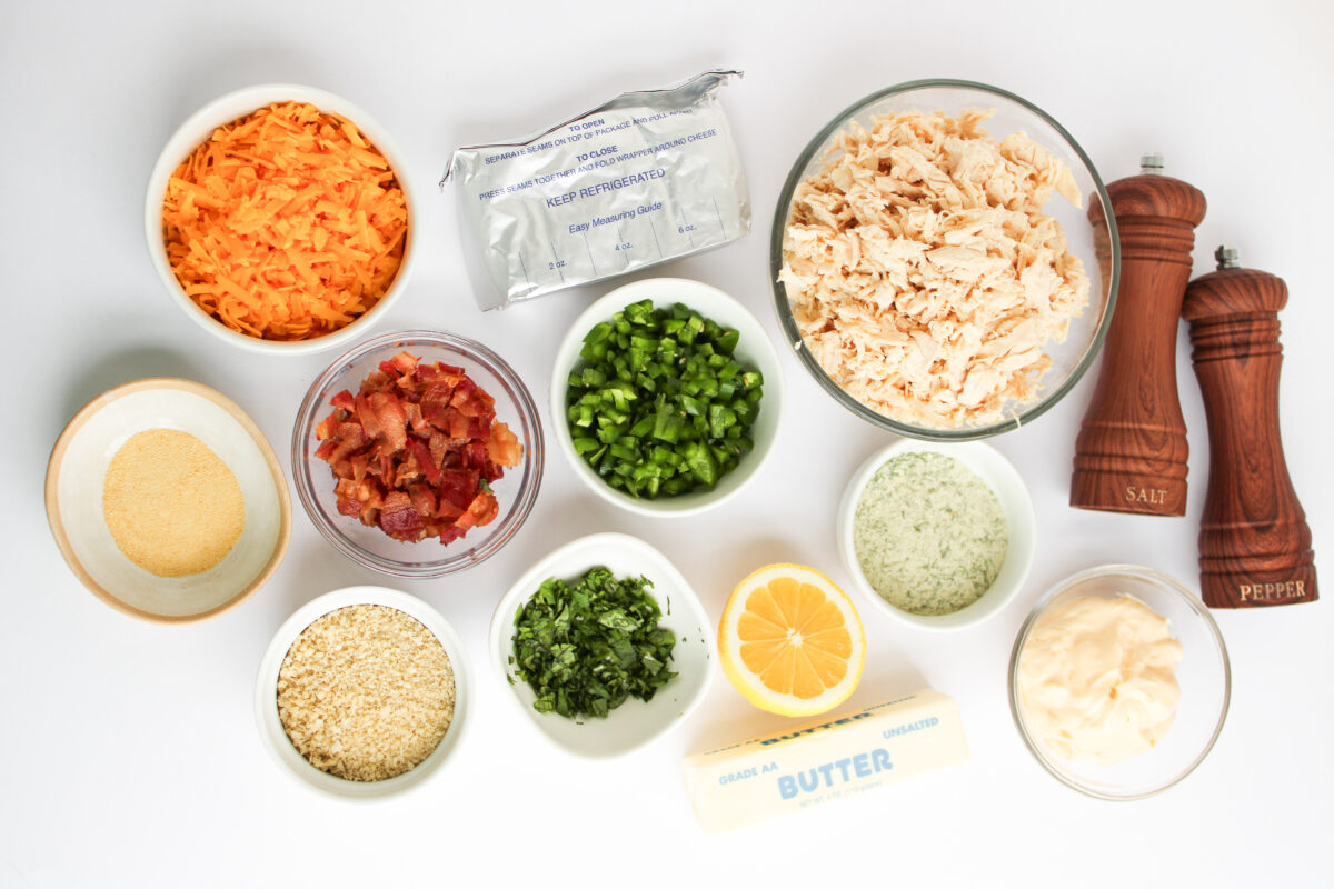 Ingredients laid out on white background in different sized bowls.