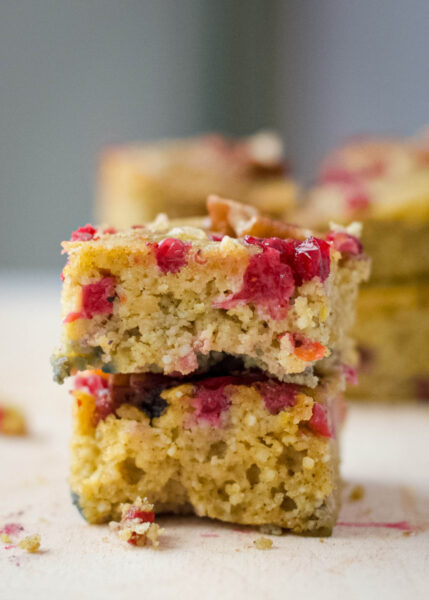 stacked slices of baked gluten free cranberry coffee cake 