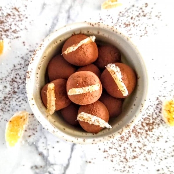 ginger date balls in white ramekin