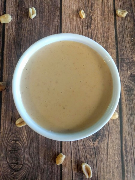 Overhead view of healthy peanut sauce in ramekin