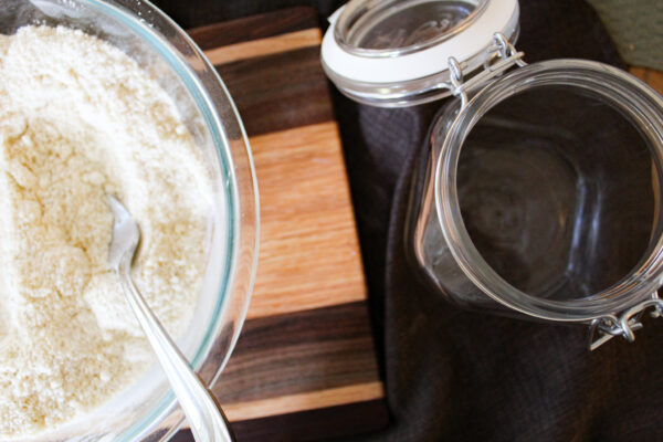 paleo powder mix in bowl with empty jar next to it