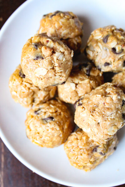 peanut butter chocolate protein balls in a white bowl