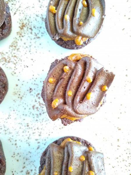 Pumpkin filled brownie bites decorated with chocolate frosting